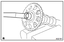 REMOVE CAMSHAFT TIMING GEAR OR SPROCKET