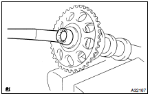 INSTALL CAMSHAFT TIMING GEAR OR SPROCKET