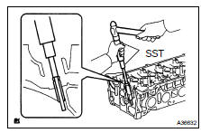 REMOVE INTAKE VALVE GUIDE BUSH