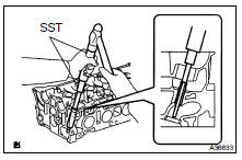 REMOVE EXHAUST VALVE GUIDE BUSH