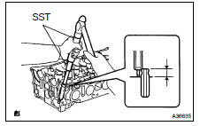 INSTALL EXHAUST VALVE GUIDE BUSH