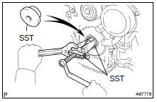 REMOVE TIMING GEAR CASE OR TIMING CHAIN CASE OIL SEAL