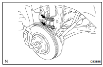 REMOVE FRONT SHOCK ABSORBER WITH COIL SPRING