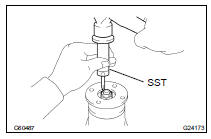 REMOVE REAR DRIVE PINION NUT