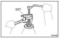 REMOVE REAR DIFFERENTIAL CARRIER OIL SEAL