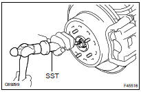 REMOVE REAR AXLE SHAFT LH NUT