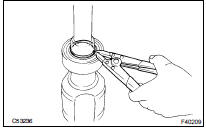 REMOVE FRONT DRIVE SHAFT BEARING