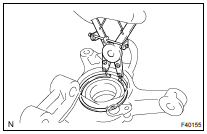 REMOVE FRONT AXLE HUB LH HOLE SNAP RING