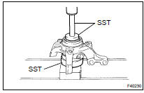 REMOVE FRONT AXLE HUB LH BEARING