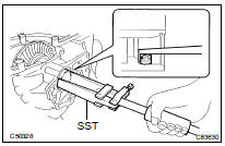 REMOVE TRANSFER CASE OIL SEAL