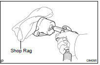 REMOVE FRONT DISC BRAKE PISTON