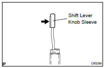 INSTALL SHIFT LEVER KNOB SLEEVE