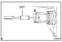 REMOVE DIFFERENTIAL SIDE BEARING RETAINER OIL SEAL