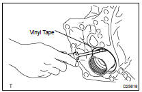 REMOVE TRANSAXLE HOUSING OIL SEAL