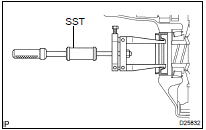 REMOVE DIFFERENTIAL SIDE BEARING RETAINER OIL SEAL