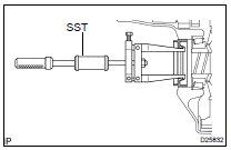 REMOVE DIFFERENTIAL SIDE BEARING RETAINER OIL SEAL