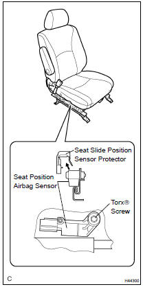 REMOVE SEAT SLIDE POSITION SENSOR PROTECTOR