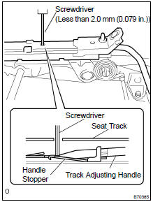  REMOVE REAR SEAT TRACK ADJUSTING HANDLE