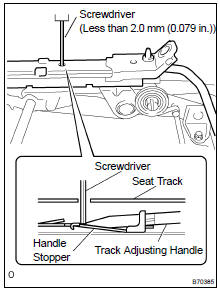 REMOVE REAR SEAT TRACK ADJUSTING HANDLE