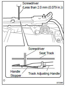 REMOVE REAR SEAT TRACK ADJUSTING HANDLE