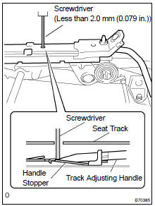 REMOVE REAR SEAT TRACK ADJUSTING HANDLE