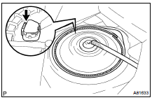 REMOVE REAR FLOOR SERVICE HOLE COVER